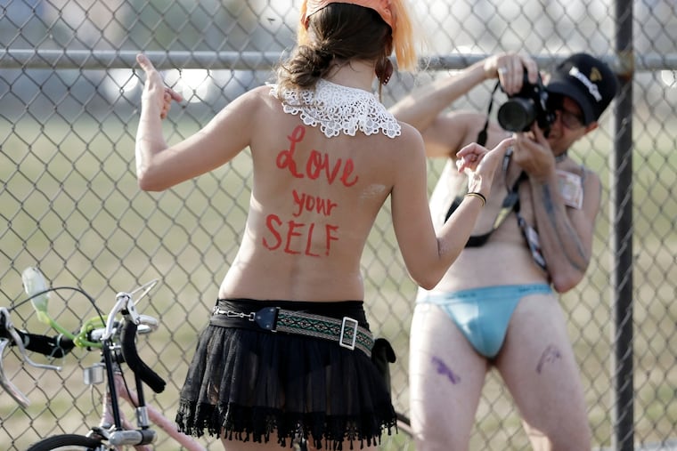 The end of the Philly Naked Bike Ride at Jefferson Square Park in Phila. on August 29, 2015. ( ELIZABETH ROBERTSON / Staff Photographer )