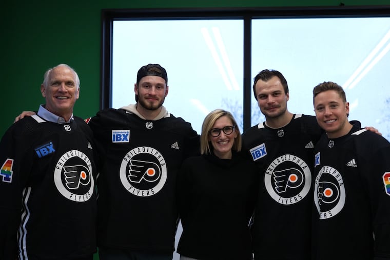 From left, Dan Hilferty, Joel Farabee, Scott Laughton, and Cam Atkinson visited the Mazzoni Center this week to make a donation on the Flyers' behalf to the LGBTQ+ organization.
