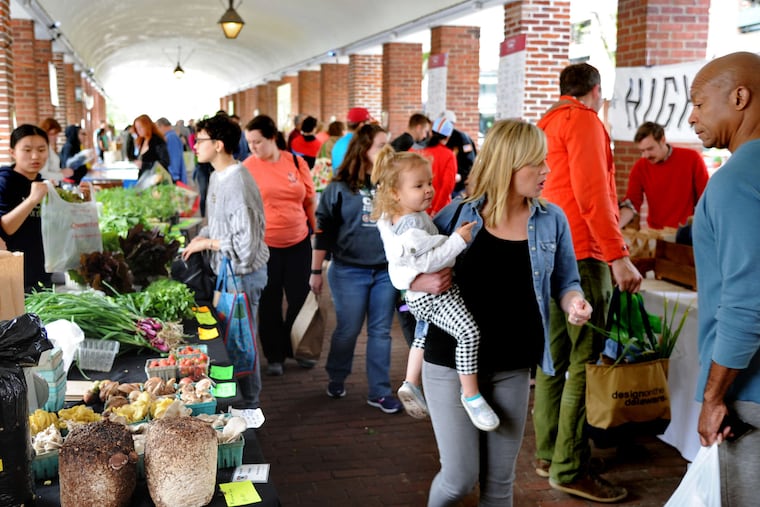 Shoppers at Headhouse Farmers' Market. The typical customer, says a Farm to City manager, will spend $25 to $30 at a market. "If you add more vendors," he said, "they just spread the $25" among more stands.