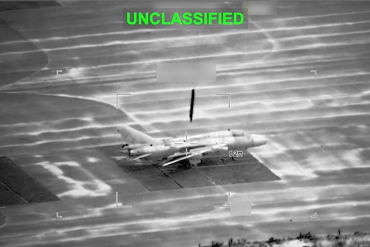 This partially redacted image from video provided by U.S. Central Command shows a military aircraft in Iran shortly before it was struck by a missile fired by U.S. forces on March 1.