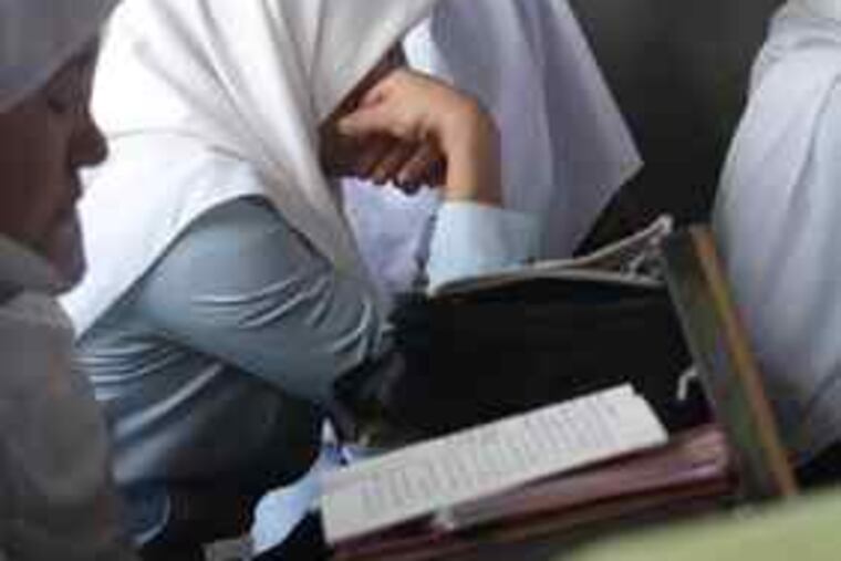 Afghan students during a class. The photos from the project will be displayed at the National Constitution Center in Philadelphia and at the National Museum of Afghanistan in Kabul.