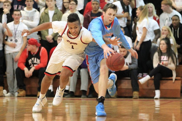 Amin Bryant, left, of Archbishop Ryan and Tom Quarry of Father Judge go after a loose ball after Bryant had deflected it away in the second quarter on Jan. 19, 2018.