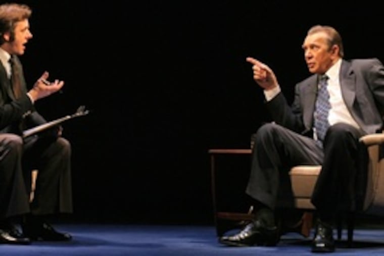 Michael Sheen as David Frost interviews Frank Langella as Richard Nixon. The play recalls Frost's interview with Nixon after Watergate, which drew the largest audience for an interview in TV history.