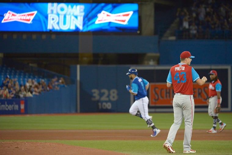 Nick Pivetta looks away as Blue Jays' slugger Kendrys Morales rounds the bases after a two-run homer on Saturday.