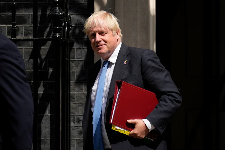 British Prime Minister Boris Johnson leaves 10 Downing Street, in London, to attend the weekly Prime Minister's Questions at the Houses of Parliament on Wednesday.