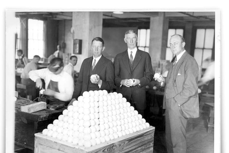 Paying a 1927 visit to A.J. Reach & Co. in Fishtown are (from left) Eddie Collins, Connie Mack, and Ty Cobb of the Philadelphia Athletics. They are examining some of the baseballs that the factory produced for use by the teams in the American League. The factory building is being converted into 30 apartments.