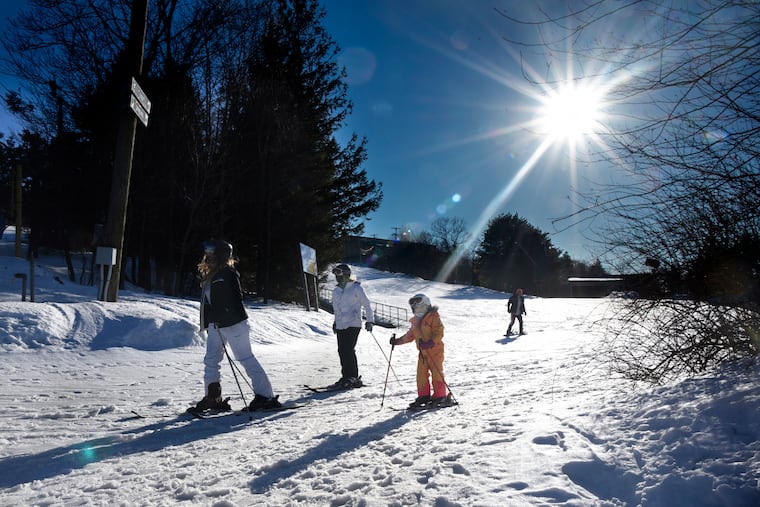 Skiers are on Blue Mountain in the Poconos on Wednesday, where after years of mild winters and lack of snow, ski resorts are experiencing a boom season with sell-out crowds driven to escape pandemic claustrophobia.