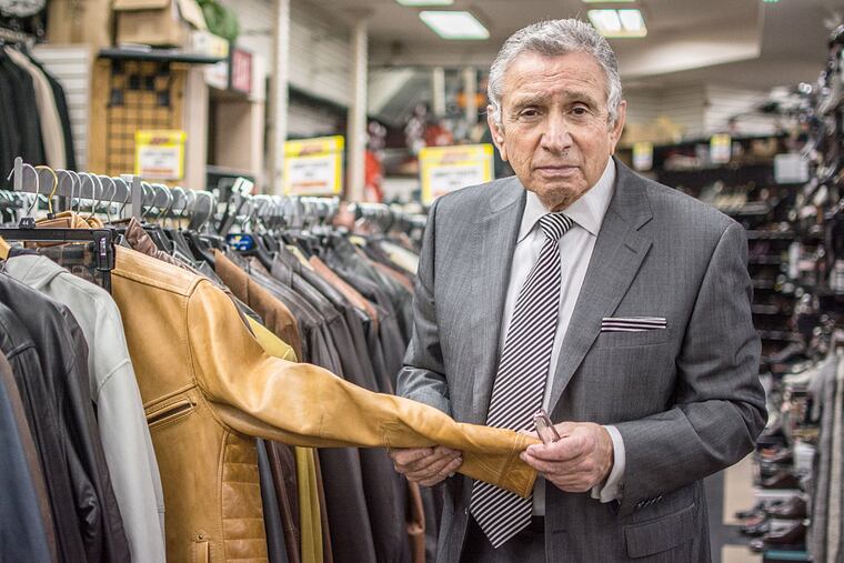 Abe Mandel shows off a leather jacket in A Man's Image, on East Passyunk Avenue in Philadelphia.