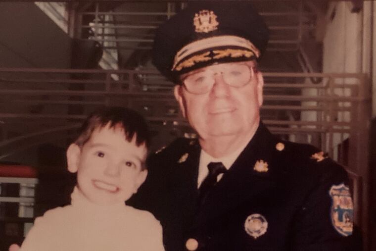 Mr. Orbell doted on his grandchildren. Here, he stands with grandson Jacob. They called him Poppy.