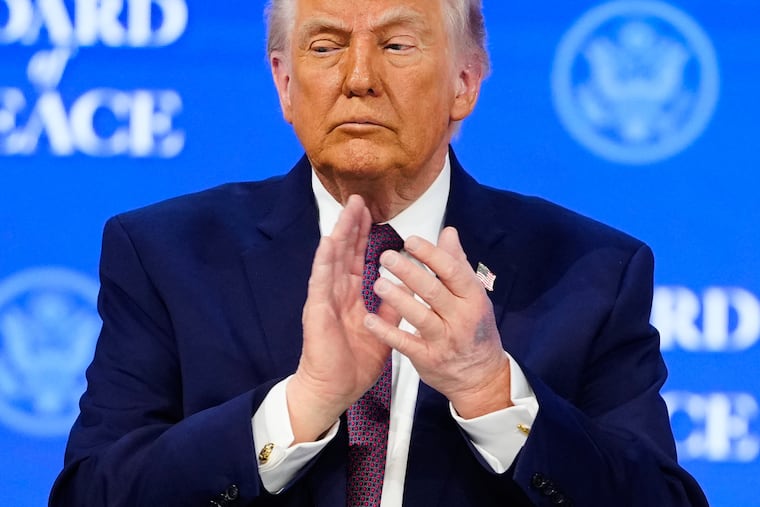 President Donald Trump applauds during a signing ceremony on his Board of Peace initiative at the annual meeting of the World Economic Forum in Davos, Switzerland, on Thursday.