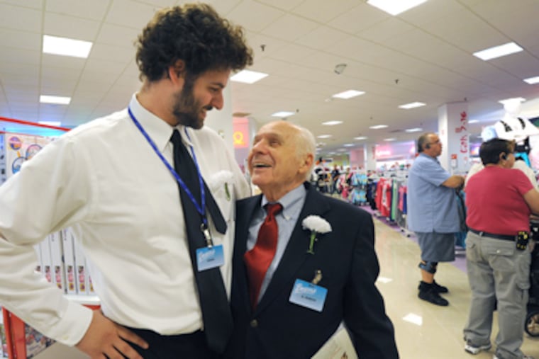 Albert Boscov visits with sales associate Derek Badichek at the Boscov's that will open Sunday in Monmouth Mall. (April Saul / Staff Photographer)