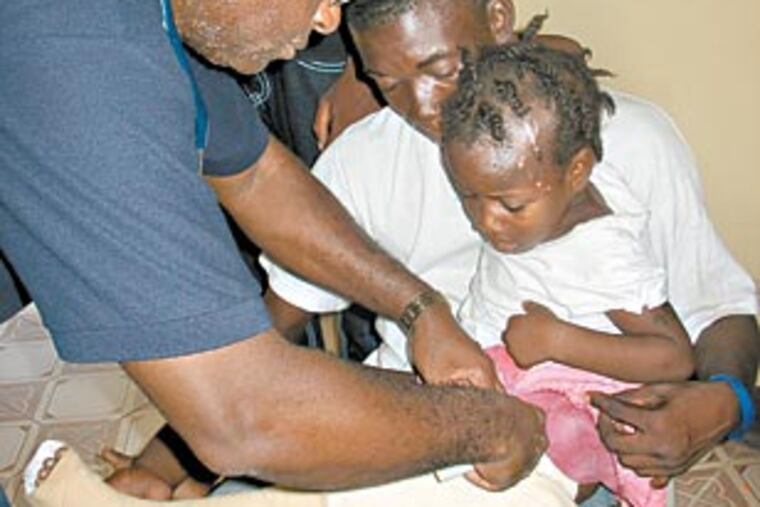 Jenny Raymon, 6, gets treated for a fractured hip. (Melissa Dribben / For the Inquirer)