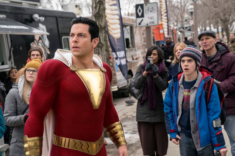 This image released by Warner Bros. shows Zachary Levi, left, and Jack Dylan Grazer in a scene from "Shazam!"