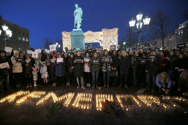 People in Moscow stand in front of the word “Kemerovo,” made up of candles to commemorate the victims of a fire in a shopping mall in the Siberian city of Kemerovo. Several Russian cities held rallies to commemorate the dead.
