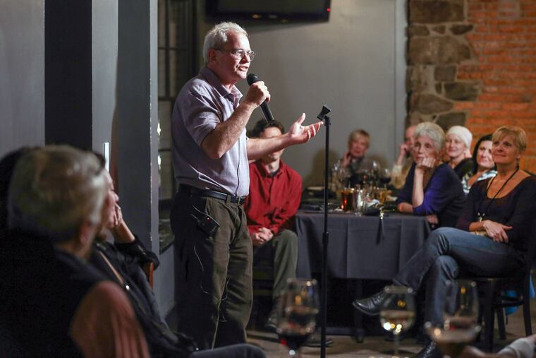 Judge Patrick Carmody of West Chester delivers his blood and guts tale at a story slam at Side Bar and Restaurant. Themed storytelling competitions are gaining popularity.