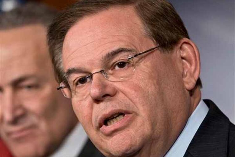 FILE - In this Jan. 28, 2013 file photo, Sen. Robert Menendez, D-N.J. speaks on Capitol Hill in Washington. Menendez's office says he traveled on a plane owned by a Florida physician who is a friend and political donor, but denied that the senator had engaged with prostitutes in the Dominican Republic. (AP Photo/J. Scott Applewhite, File)