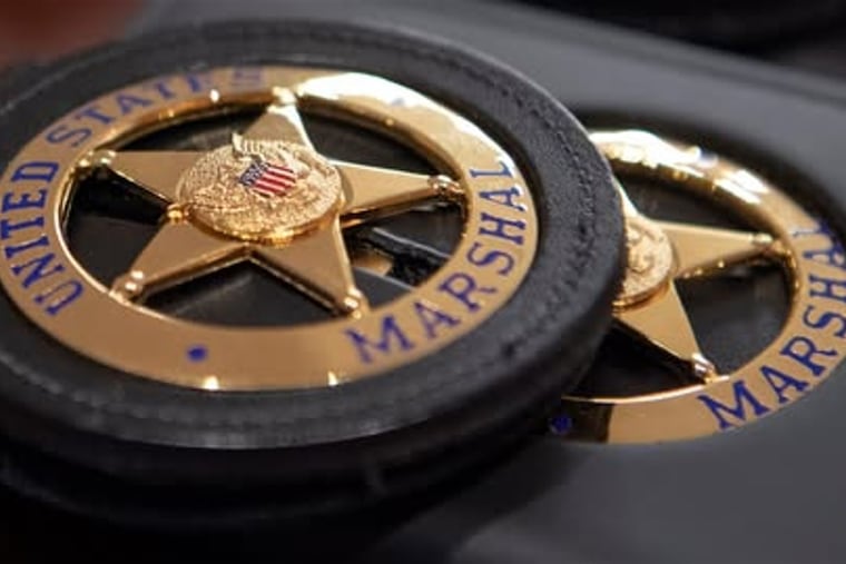 File photo of U.S. Marshals Service badge.
