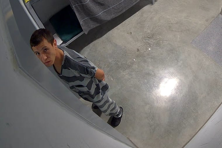 In this image from video provided by the Missouri State Highway Patrol, Immigration and Customs Enforcement detainee Brayan Rayo Garzon looks towards a surveillance camera in the Phelps County jail in Rolla, Mo., on April 7, 2025, shortly before he died by suicide. (Missouri State Highway Patrol via AP)