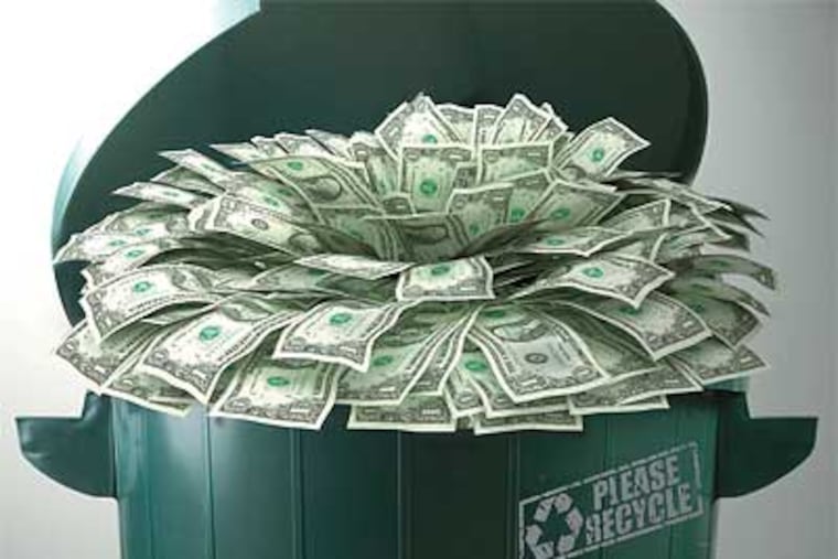 The Nutter administration is considering instituting fees for trash collection, a move that would encourage recycling and reduce costs for the city. (Daily News photo illustration)