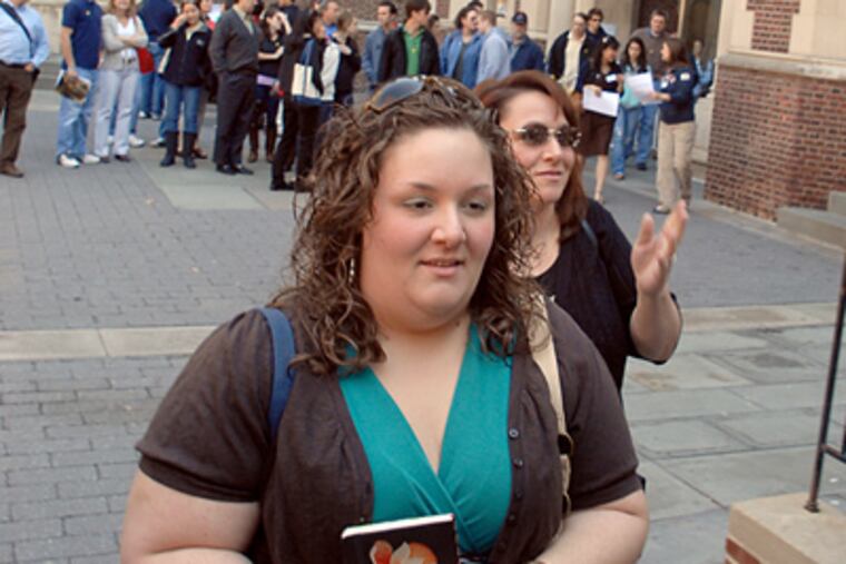 Walking through the quad on the University of Pennsylvania campus, Nazareth Academy senior Ali Derassouyan and her mother Andrea Derassouyan tour the student housing during accepted students preview day Apr. 14, 2009. ( Tom Gralish / Staff Photographer)