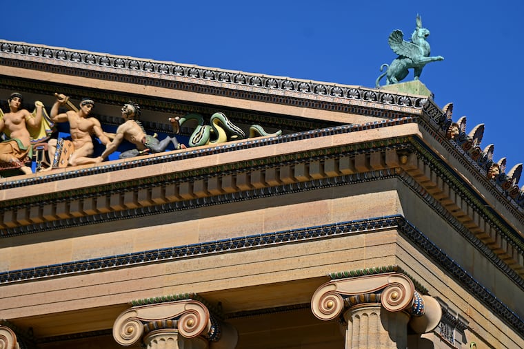 A bronze griffin statue on the roof of the northern wing of the Philadelphia Museum of Art, now called the Philadelphia Art Museum, or PhAM.