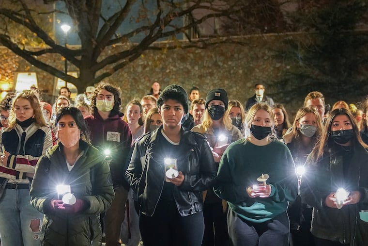 Avia Gerstel, center, at a candlelight vigil for Samuel Collington, during the vigil the names of all of the Temple students who have died in the last year were read aloud, in Philadelphia, December 6, 2021.