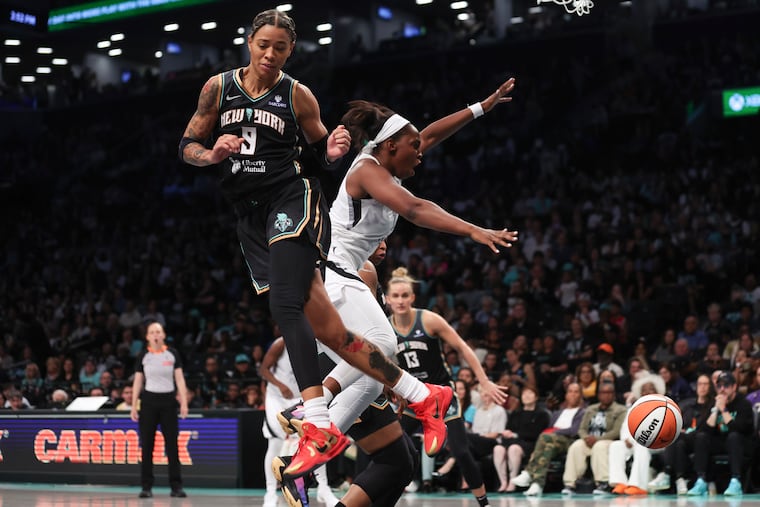 Natasha Cloud (left) had a spectacular game in her debut for the New York Liberty on Saturday.