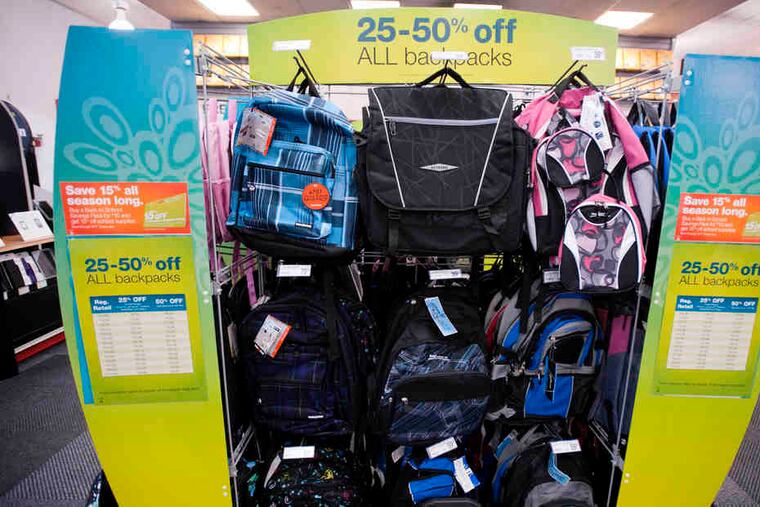 At a Staples in New York, discounted backpacks are on display. Staples is offering a $10 discount card good for 15 percent off on school supplies.