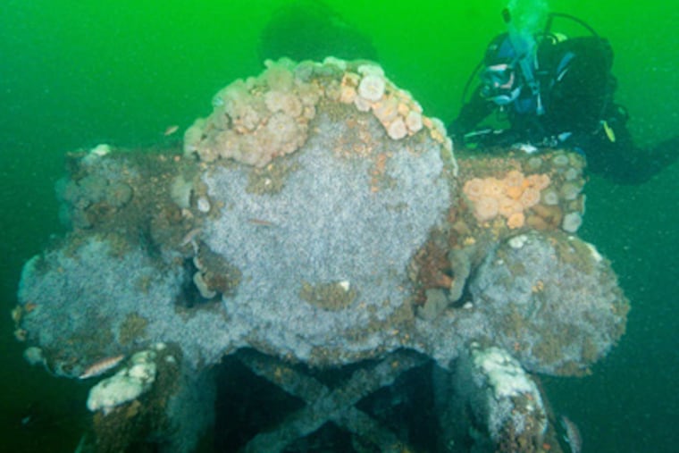 Beth Dalzell explores one of the locomotives. One theory is the engines were being shipped from Boston to a Mid-Atlantic port and were dumped in bad weather.
