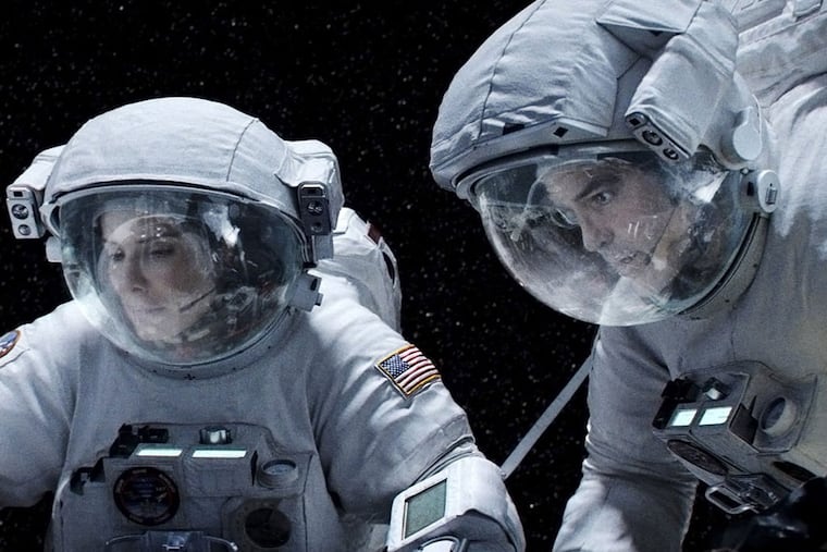 Sandra Bullock and George Clooney are astronauts caught in a storm of space debris in Alfonso Cuarón's gut-wrenching and groundbreaking "Gravity."