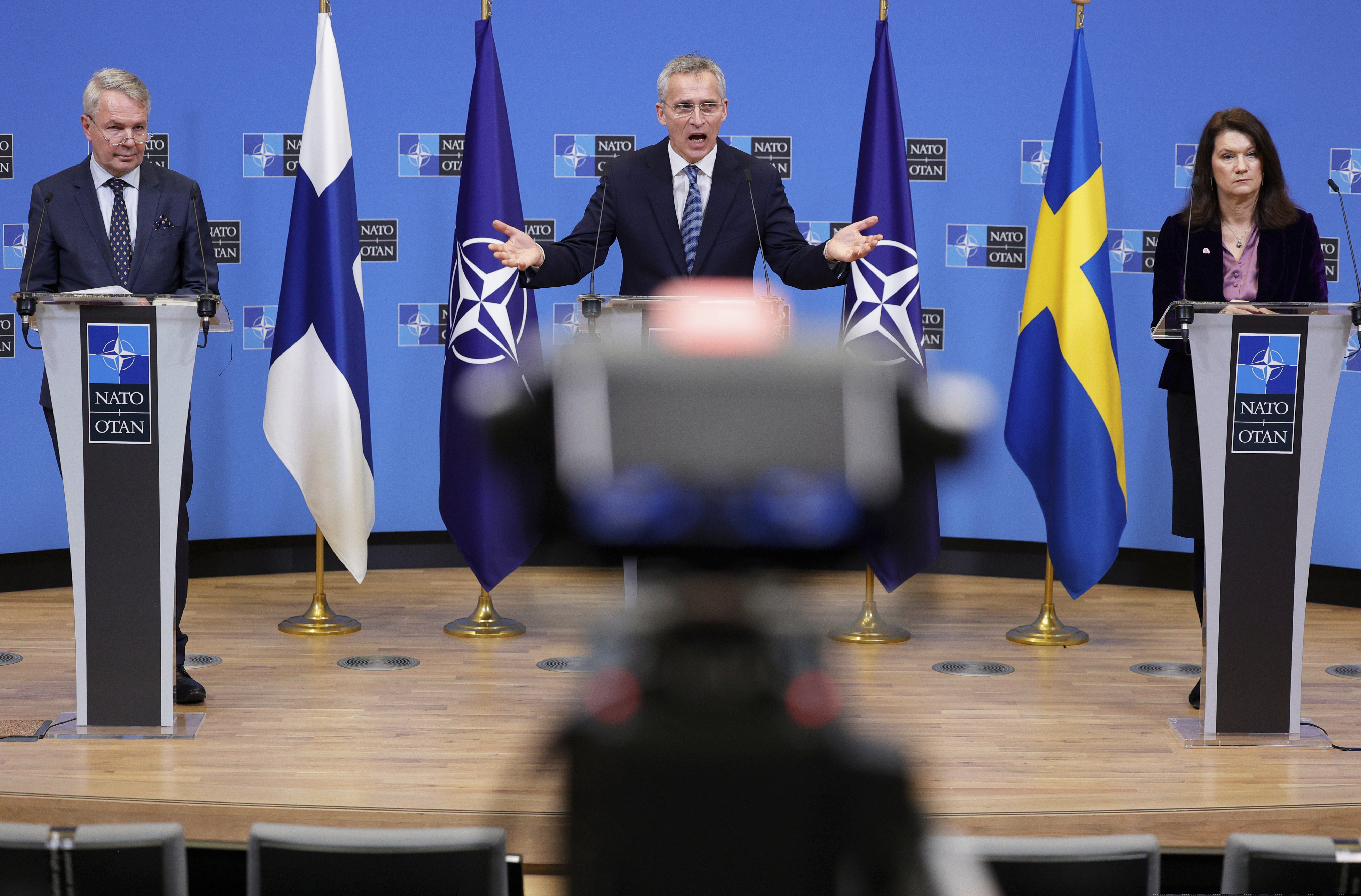 NATO Secretary General Jens Stoltenberg (center) participates in a media conference with Finland's Foreign Minister Pekka Haavisto (left) and Sweden's Foreign Minister Ann Linde at NATO headquarters in Brussels on Monday.