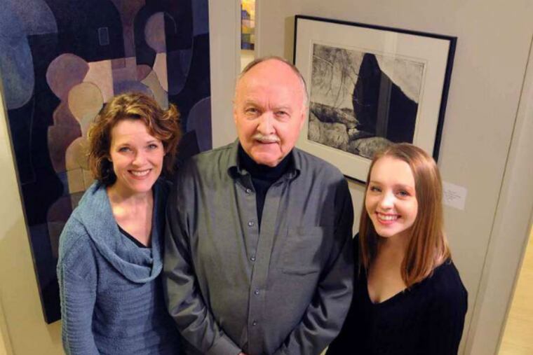 At the Ocean City Arts Center, painter Lance Balderson poses with his daughter, print-maker Jody Balderson Wiker (left), and his granddaughter, sculptor Maddelinde Wiker, and examples of their artwork from the group show opening Friday.