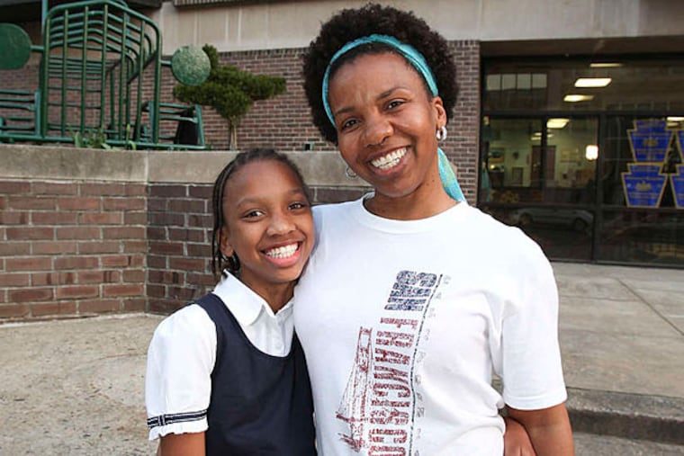 While thousands of Philadelphia school kids sat down Tuesday to begin the six days of standardized math and reading tests known as the PSSAs, Tomika Anglin was pulling her daughter Simone and a second 5th grader out of Greenfield Elementary for a couple of hours. (Steven M. Falk / Staff Photographer)
