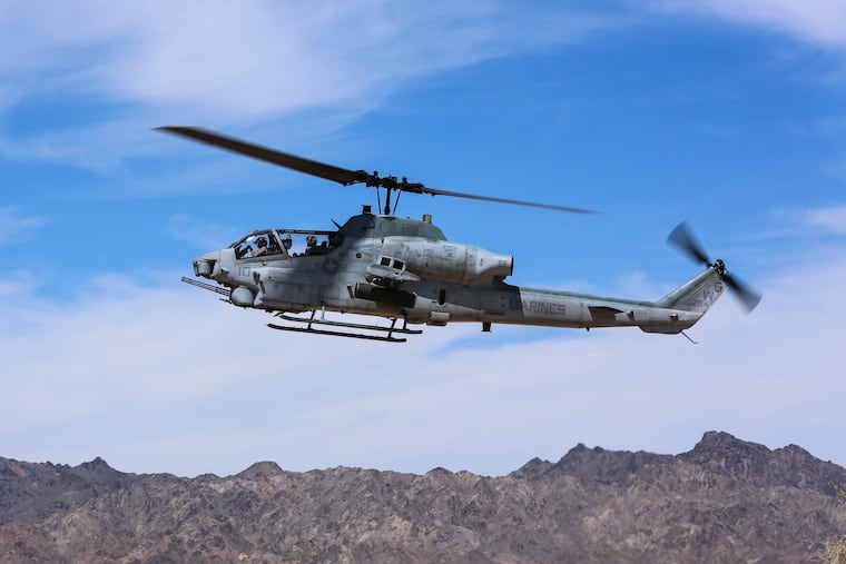 This April 17, 2017, photo released by the U.S. Marine Corps shows a AH-1Z Viper preparing to land at the Chocolate Mountain Aerial Gunnery Range, Calif. Two pilots were killed Saturday in an AH-1Z Viper helicopter crash while conducting a routine training mission near Yuma, Ariz. (Cpl. Harley Robinson/U.S. Marine Corps via AP)
