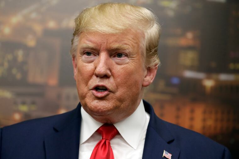 President Donald Trump speaks to reporters as he visits the El Paso Regional Communications Center after the El Paso mass shooting, on Aug. 7.