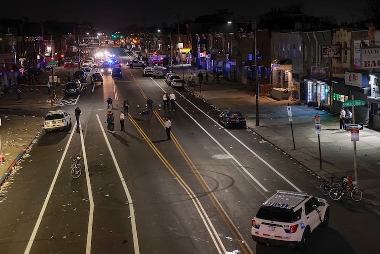 Police process part of a crime scene where multiple people were injured in a shooting in Philadelphia. City Council wants to establish a permanent 10 p.m. curfew for teenagers to help counter gun violence. Experts say it won’t work.