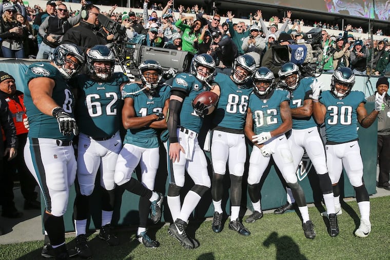 Philadelphia Eagles offensive players celebrate Eagles tight end Zach Ertz’s first-quarter touchdown against the Chicago Bears.