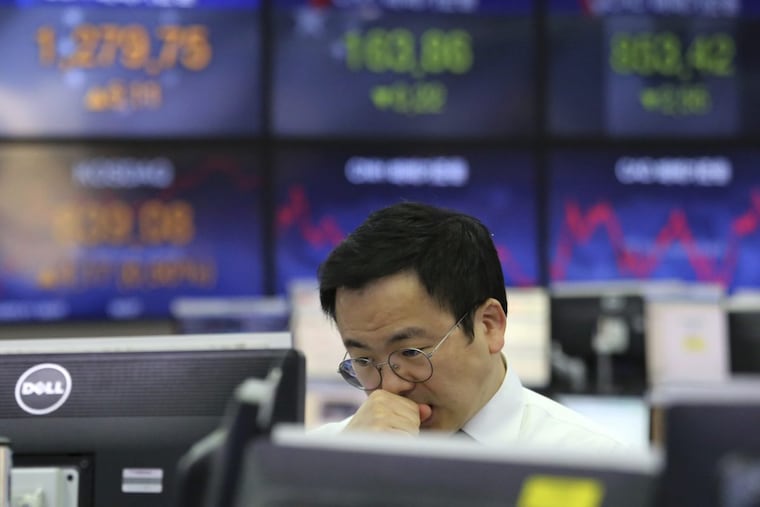 The KEB Hana Bank headquarters in Seoul, South Korea, Thursday, Jan. 11, 2018. Reports that China may slow its purchase of U.S. government bonds weighed on investor sentiment. (AP Photo/Ahn Young-joon)