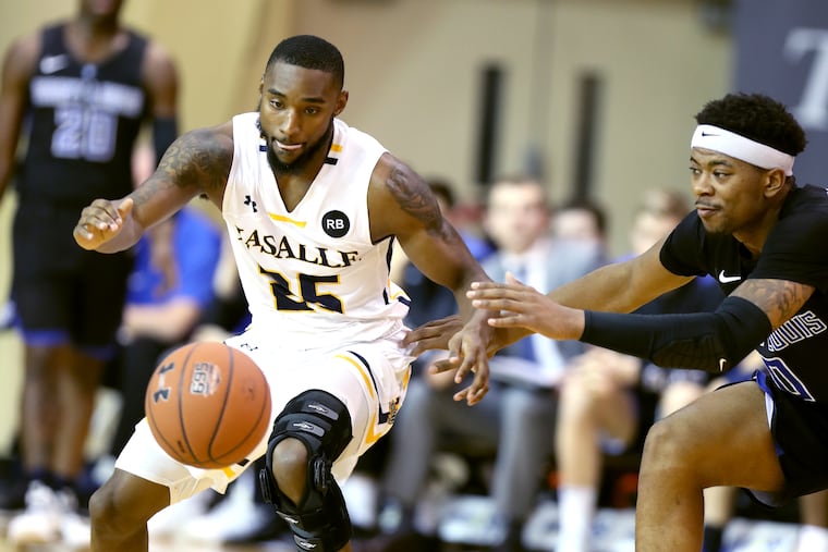 Traci Carter, left, of La Salle steals the ball away from Jordan Goodwin of Saint Louis in the 2nd half on Jan. 12, 2019.
