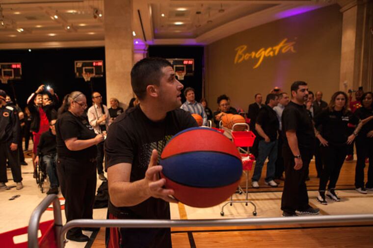 It came down to the last basket for Al Callejas of Archbald, Pa., to
take first place and a $10,000 prize, winning the Borgata's free-throw challenge March 21, 2015, in Atlantic City. Callejas, a 2001 graduate of the University of Scranton, played point guard. (CHRIS FASCENELLI/Staff Photographer)