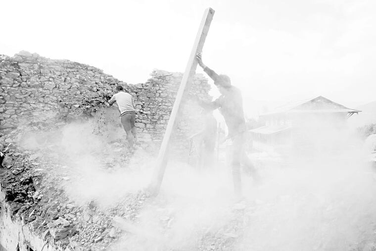 Reconstruction work goes on after the April 2015 quake that killed nearly 9,000 people. Because the Nepal government has failed to issue permits, thousands of promised homes are yet to be built.