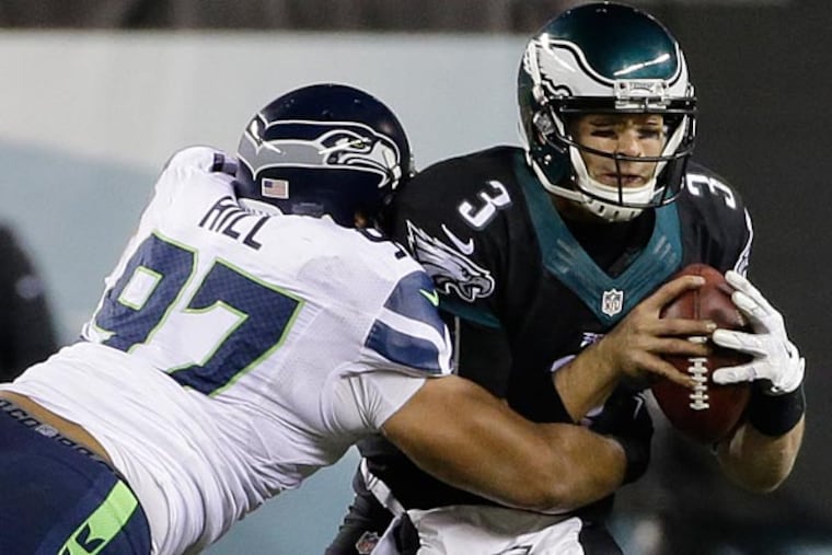Philadelphia Eagles' Mark Sanchez is sacked during the second half of
an NFL football game against the Seattle Seahawks, Sunday, Dec. 7,
2014, in Philadelphia. (Michael Perez/AP)