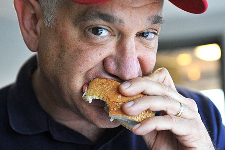 Glen Macnow sampling a Cosmi's hoagie in June 2009 at the WIP studio in Bala Cynwyd. He elected not to include it in the 50-plus official reviews of his Great Hoagie Hunt.
