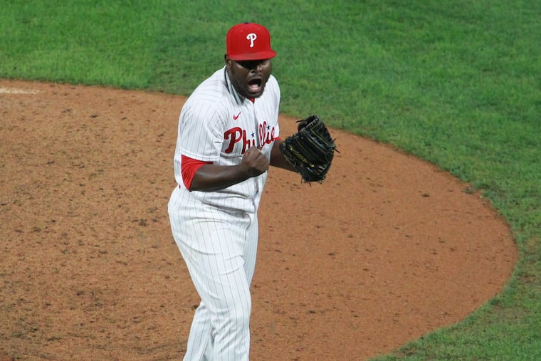 Héctor Neris of the Phillies celebrates as they get the final out against the Nationals on Sept. 1.