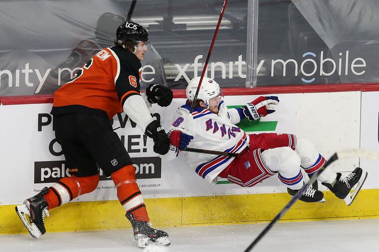 The Flyers' Travis Sanheim checked the Rangers' Brendan Lemieux during the third period at the Wells Fargo Center on Feb. 24. The Flyers beat the Rangers, 4-3. The teams will meet Monday and Wednesday at Madison Square Garden.