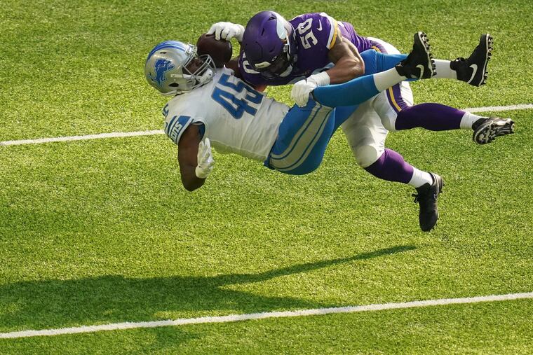 Linebacker Eric Wilson, who signed a one-year deal with the Eagles this week, makes a big hit on Lions fullback Jason Cabinda.