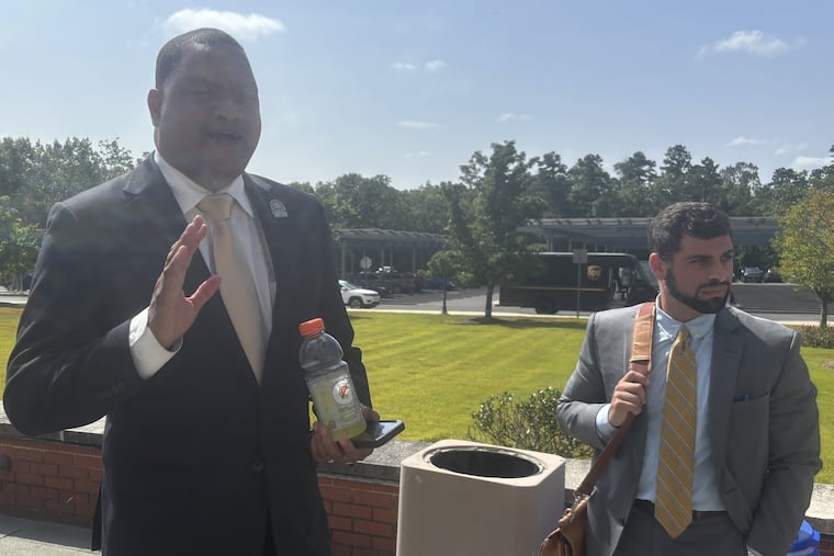 Atlantic City Mayor Marty Small Sr. (left) and attorney Jordan Barbone after a brief hearing on Monday, in which the state offered him a plea deal, on charges related to the alleged endangerment of his daughter, in which he would avoid prison but would force him to relinquish his office. Small said he would "absolutely not" take the deal. His attorney called the case, in which Small's wife, La'Quetta Small, the city schools superintendent, was also charged, "politically motivated."