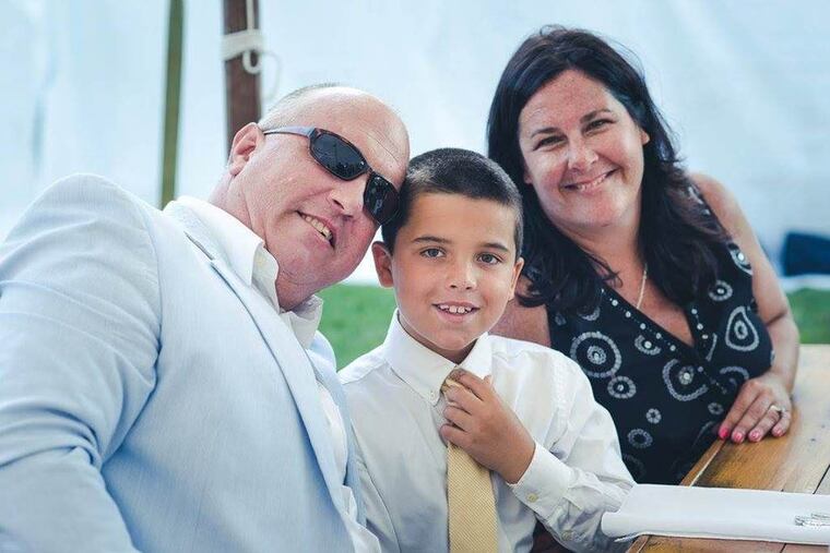 George Brooks Jennings with his wife, Jill, and his son, Matthew, now 9. Prosecutors say Jennings was shot and killed by his neighbor.