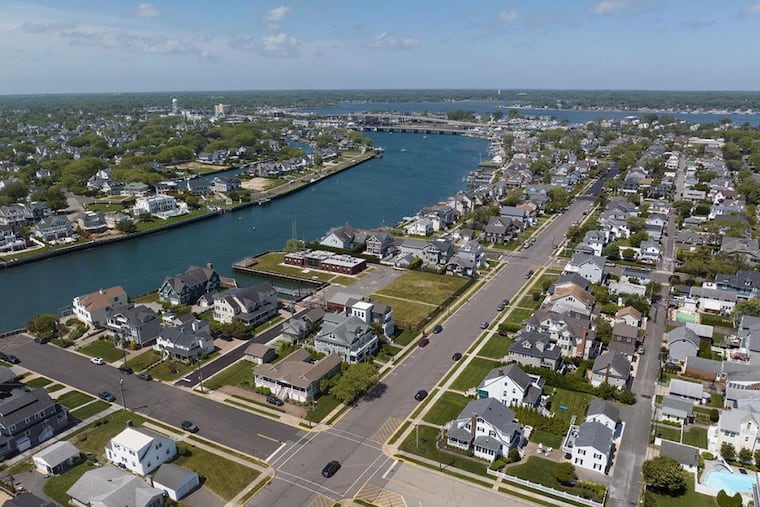 The shuttered U.S. Coast Guard Shark River station (center) in Avon-by-the-Sea, N.J., with a boat basin and pier.