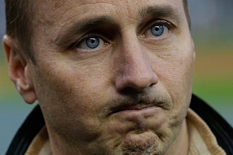 Compared to his extracurricular activities, negotiating contracts must be a breeze for Yankees general manager Brian Cashman. (Paul Sancya/AP file photo)